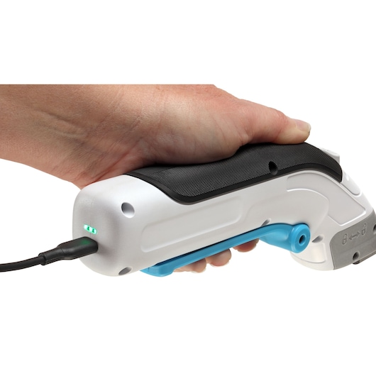 BLACKDECKER BCSC115 electric cutter with white and black body, blue trigger, charging with LED indicator, side view.