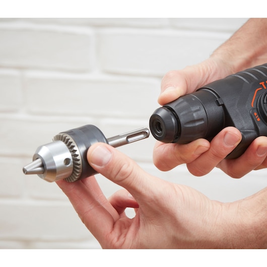 BLACKDECKER BEHS01 hammer drill with metal chuck attachment being installed, close-up view.