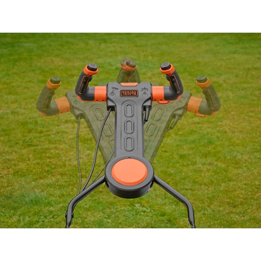 BLACKDECKER BEMW471ES lawn mower adjustable handle in grass, top angle photo.