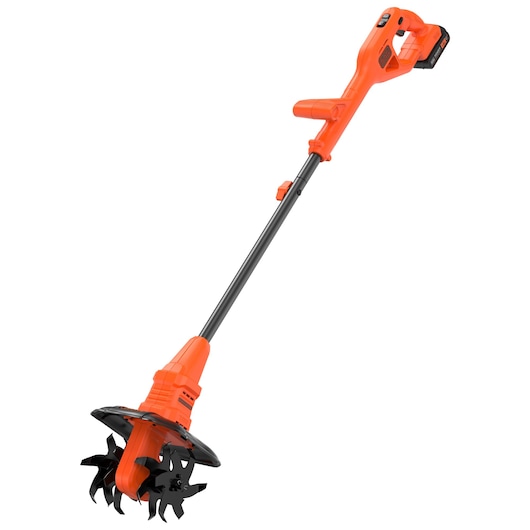 A cordless orange BLACK+DECKER garden tiller with a detachable battery and two black rotating blades, shown against a white background.