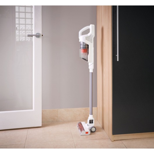 BLACKDECKER BHFEA515J cordless stick vacuum cleaner in white, upright in a kitchen corner