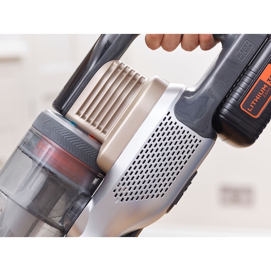 Close-up photo of BLACKDECKER cordless vacuum cleaner BHFEV36B2D handle and dust container in use.