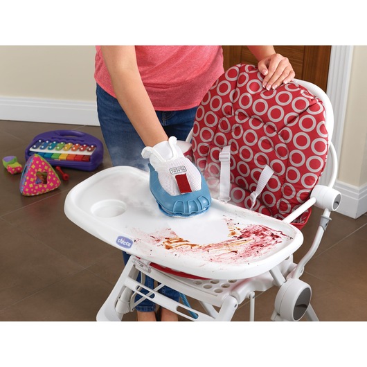 BLACKDECKER BHSM1610DSM steam cleaning glove cleaning a stained high chair tray, red and white patterned seat visible.