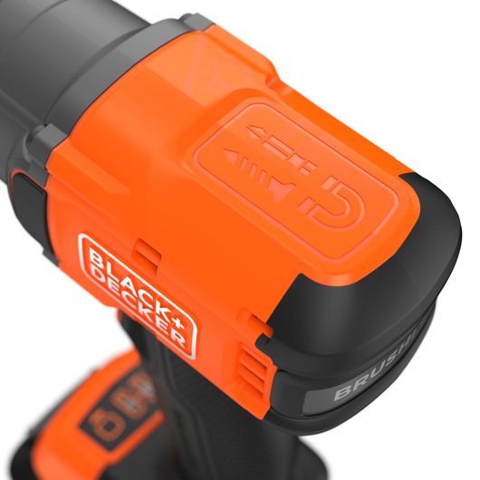 BLACK+DECKER BLIM78N cordless drill close-up, showing orange and black housing, brand logo, and power button, angled view.