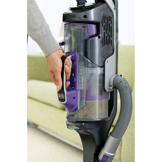 BLACKDECKER CUA525BHP upright vacuum cleaner close-up with purple handle and transparent dust chamber.