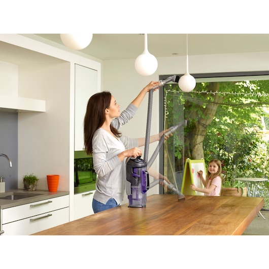BLACKDECKER CUA525BHP vacuum cleaner used for cleaning on kitchen counter and pendant light.